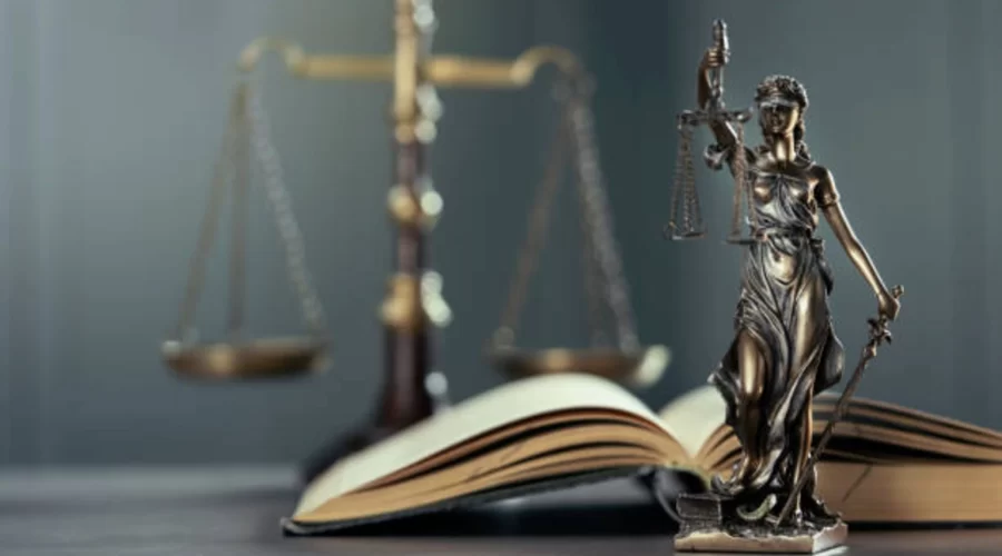 Gavel and legal documents beside a bottle of paraquat herbicide, representing the Paraquat Lawsuit