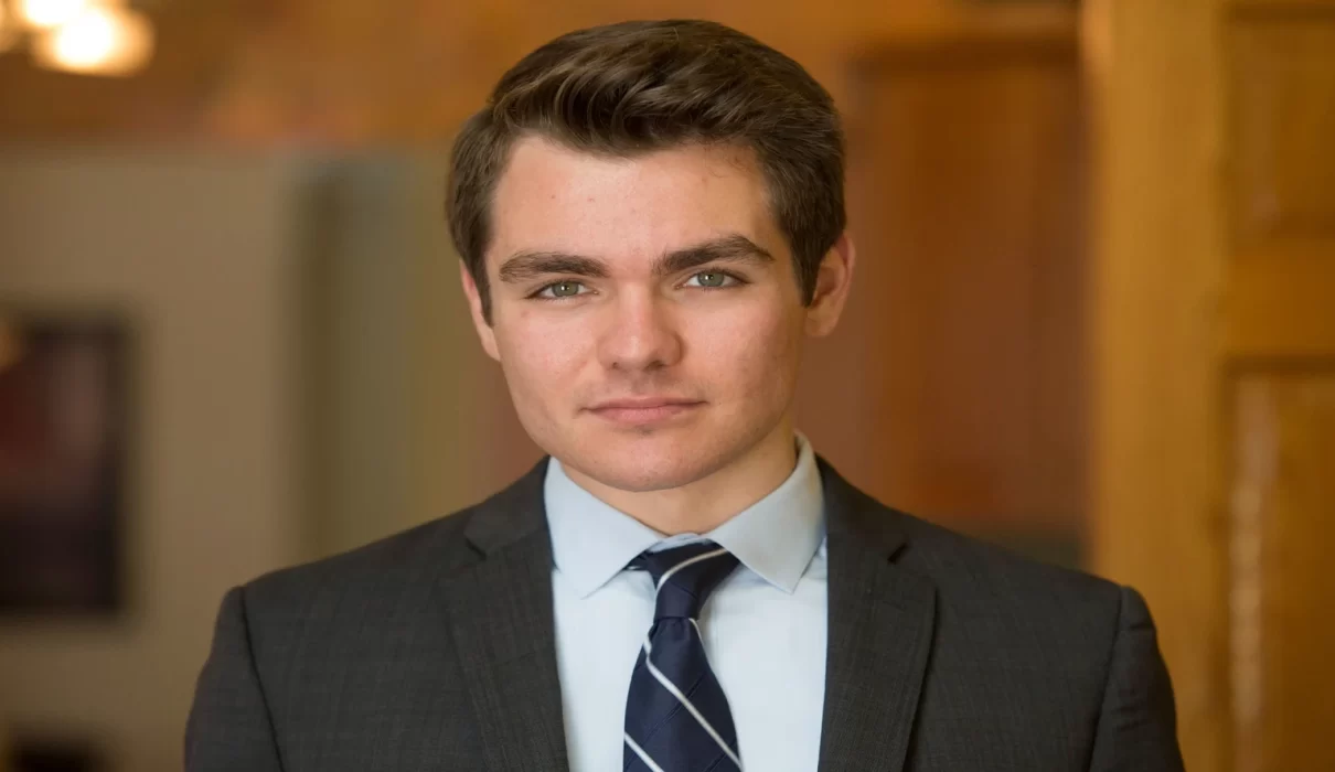 Nick Fuentes net worth article featured graphic with income source icons