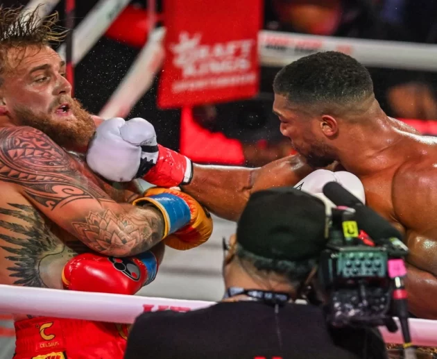 Jake Paul and Anthony Joshua during their December 2025 boxing match amid fight fixing controversy