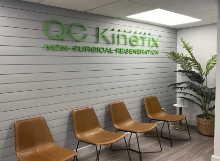 Patient and clinician reviewing joint pain treatment options and paperwork during a consultation