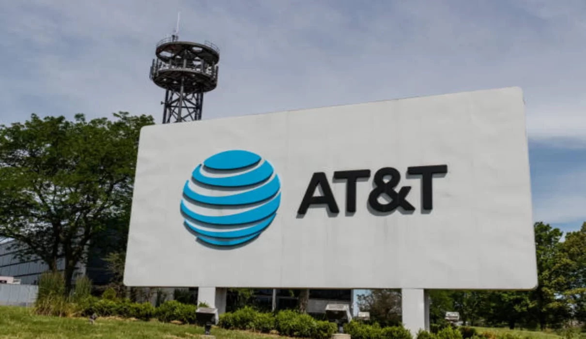Illustration of a courthouse, legal document, and security shield representing the AT&T data breach settlement