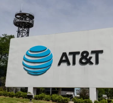 Illustration of a courthouse, legal document, and security shield representing the AT&T data breach settlement