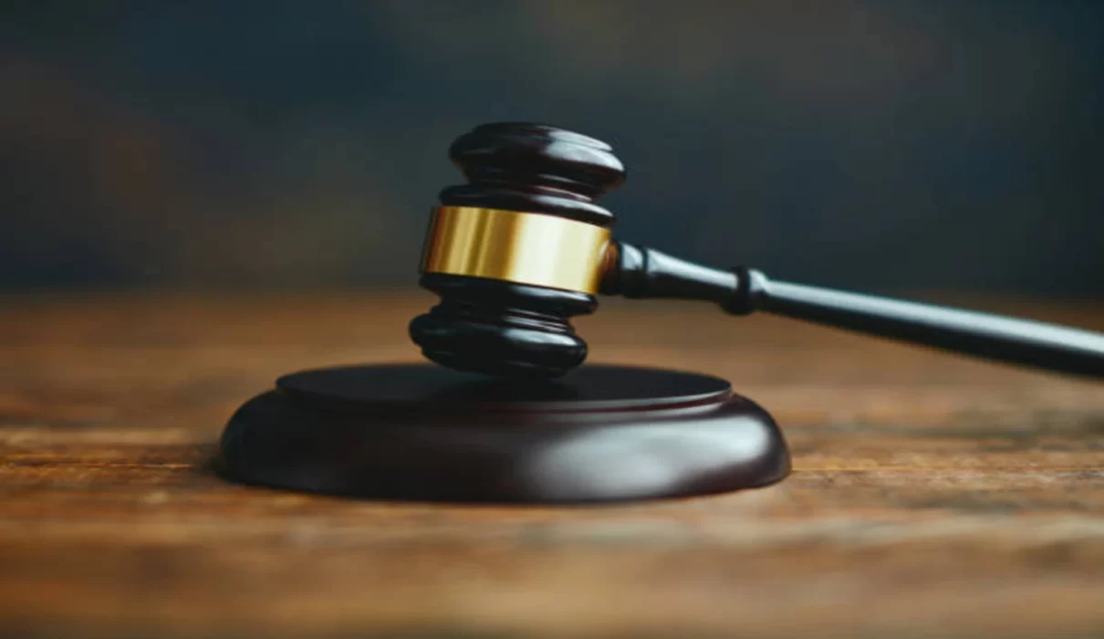 Gavel resting on legal documents in a courtroom