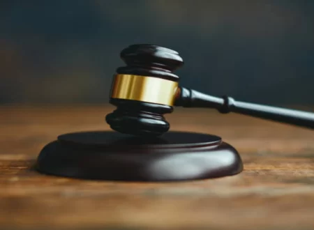 Gavel resting on legal documents in a courtroom