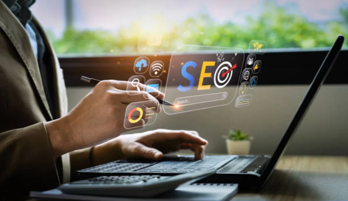 Illustration of a laptop with a growth chart, map pin, and search icons representing SEO and digital marketing