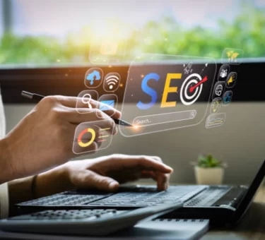 Illustration of a laptop with a growth chart, map pin, and search icons representing SEO and digital marketing